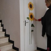 Anne-Marie decorates our place with stick-ons from the Mr. Bricolage.