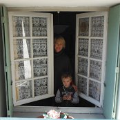 Mom and son at the dining window.