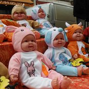 Rows of laughing babies; just poke them and they laugh (so Hudson poked them all). Displayed at the local market.
